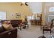 Open floor plan showcasing living room with vaulted ceilings seamlessly flowing into kitchen and dining areas at 16032 Hollingbourne Rd, Huntersville, NC 28078