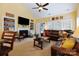 Cozy living room showcases fireplace, built-in shelving, and a comfortable seating area at 16032 Hollingbourne Rd, Huntersville, NC 28078