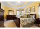 Spacious bedroom with tray ceiling, decorative bedding, and ample natural light at 16032 Hollingbourne Rd, Huntersville, NC 28078