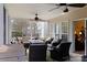 Screened patio offers an outdoor dining area and ceiling fans for added comfort at 16032 Hollingbourne Rd, Huntersville, NC 28078