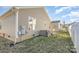 Home's backyard with a white fence, patio, and green lawn at 1720 Dewberry Pl, Salisbury, NC 28146