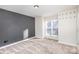 Neutral colored bedroom with carpet flooring and a gray accent wall at 1720 Dewberry Pl, Salisbury, NC 28146