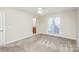 Bedroom features carpet, a ceiling fan, natural light, and a view of the attached bathroom at 1720 Dewberry Pl, Salisbury, NC 28146