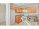 Kitchen with wooden cabinets, stainless steel appliances, and tile floor at 1720 Dewberry Pl, Salisbury, NC 28146