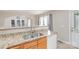 Kitchenette featuring granite countertops, wood cabinets, and a stainless steel sink at 1720 Dewberry Pl, Salisbury, NC 28146