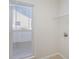 Bright laundry room with a window and tile flooring at 1720 Dewberry Pl, Salisbury, NC 28146