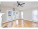 Open living room, with wood floors, ceiling fan, and lots of natural light at 1720 Dewberry Pl, Salisbury, NC 28146