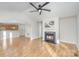 Spacious open concept featuring wood floors, fireplace, and open access to a kitchen eating bar at 1720 Dewberry Pl, Salisbury, NC 28146