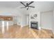 Spacious open concept featuring wood floors, fireplace, and open access to a kitchen eating bar at 1720 Dewberry Pl, Salisbury, NC 28146