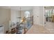 A living room with a wrought iron railing overlooking a fireplace and floor-to-ceiling windows at 20105 Chapel Point Ln, Cornelius, NC 28031
