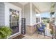 Inviting front porch with comfortable seating and decorative welcome sign, perfect for relaxing outdoors at 205 Falls Cove Dr, Troutman, NC 28166