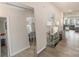 Elegant hallway with mirror accents, decorative table, and stylish decor, leading to the living spaces at 205 Falls Cove Dr, Troutman, NC 28166