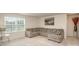 Inviting living room with a comfortable sectional sofa and soft natural light at 205 Falls Cove Dr, Troutman, NC 28166