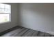 Bright bedroom features modern gray floors and a large window at 232 Sugar Hill Rd, Troutman, NC 28166
