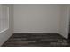 The bedroom features durable flooring and a window that provides natural light at 248 Mills Ave, Troutman, NC 28166