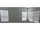 The bedroom features neutral walls, durable floors, and multiple windows at 248 Mills Ave, Troutman, NC 28166