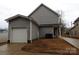View of the home's exterior featuring the attached garage and neutral siding at 248 Mills Ave, Troutman, NC 28166
