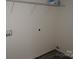 Functional laundry room features shelving, washer and dryer hookups, and durable flooring at 248 Mills Ave, Troutman, NC 28166
