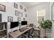 Well-lit home office featuring dual monitors, a spacious desk, and stylish decor on the walls at 2638 Trinity St, Monroe, NC 28110