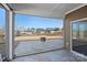 Covered back porch with view of fenced backyard and fire pit at 3012 Seville St, Charlotte, NC 28214