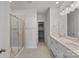 Bathroom featuring a glass enclosed shower and dual sink vanity at 3012 Seville St, Charlotte, NC 28214