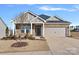 Charming home featuring stone accents, a two-car garage, and well-maintained landscaping at 3012 Seville St, Charlotte, NC 28214