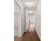 Bright hallway featuring hardwood floors, crown molding, and recessed lighting throughout the home at 3012 Seville St, Charlotte, NC 28214