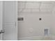 Laundry room featuring a washer and dryer hookup, storage shelves, and a spacious design at 3012 Seville St, Charlotte, NC 28214