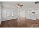 Open-concept living area featuring hardwood floors, a kitchen island, and lots of natural light at 3012 Seville St, Charlotte, NC 28214
