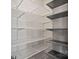 Walk-in closet with white and gray custom shelving at 3012 Seville St, Charlotte, NC 28214
