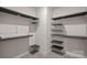 Spacious walk-in closet with custom shelving for optimal organization at 3012 Seville St, Charlotte, NC 28214