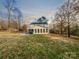 Large backyard with an enclosed screened-in porch provides ideal space for outdoor enjoyment at 316 Epperstone Ln, Matthews, NC 28105