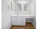 A bathroom featuring a vanity, drawers, sink, and wood floors at 316 Epperstone Ln, Matthews, NC 28105