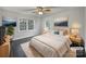 Comfortable bedroom featuring soft lighting, neutral tones, and scenic outdoor views at 316 Epperstone Ln, Matthews, NC 28105