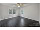 Bright bedroom with hardwood floors and natural light streaming through the windows at 316 Epperstone Ln, Matthews, NC 28105