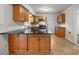Well-equipped kitchen featuring dark countertops, wood cabinets, and stainless steel appliances at 316 Epperstone Ln, Matthews, NC 28105