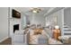 Bright, airy living room with neutral tones, a fireplace, and ample seating perfect for gatherings at 316 Epperstone Ln, Matthews, NC 28105