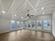 A spacious sun room featuring lots of natural light and a ceiling fan at 316 Epperstone Ln, Matthews, NC 28105