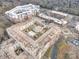 Elevated view of the building's rooftop courtyard and pool, surrounded by the complex and local architecture at 3920 Sharon Rd # 208, Charlotte, NC 28211