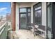 Balcony with seating and outdoor decor, overlooking the parking lot at 3920 Sharon Rd # 208, Charlotte, NC 28211