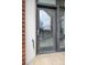 Close up of a glass door with mini-blinds leading to the balcony at 3920 Sharon Rd # 208, Charlotte, NC 28211
