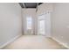 Bright bedroom with neutral carpet, natural light from a window and a door to a balcony at 3920 Sharon Rd # 208, Charlotte, NC 28211