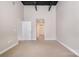 Bedroom featuring neutral carpet and an entrance to the bathroom and walk-in closet at 3920 Sharon Rd # 208, Charlotte, NC 28211