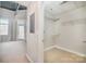 Walk-in closet with wire shelving and neutral carpet, located just off the bedroom at 3920 Sharon Rd # 208, Charlotte, NC 28211