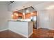 Features updated appliances, plenty of counter space, and a breakfast bar, perfect for morning meals and gatherings at 3920 Sharon Rd # 208, Charlotte, NC 28211