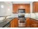 Features stainless steel appliances, granite countertops, and ample storage space, perfect for cooking enthusiasts at 3920 Sharon Rd # 208, Charlotte, NC 28211