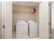 Laundry room with side by side washer and dryer and wire shelf storage above at 3920 Sharon Rd # 208, Charlotte, NC 28211