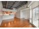 Spacious living area with an open floor plan, seamless transition to the modern kitchen with lots of natural light at 3920 Sharon Rd # 208, Charlotte, NC 28211