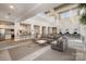 The community lounge showcases ample seating, a convenient kitchenette, and a bright, airy atmosphere at 3920 Sharon Rd # 208, Charlotte, NC 28211