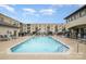 Relaxing outdoor pool area features comfortable lounge chairs for unwinding in style at 3920 Sharon Rd # 208, Charlotte, NC 28211